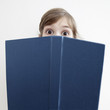 suprised little girl  with book