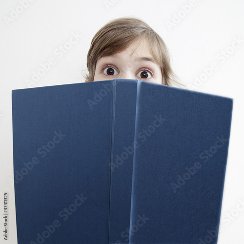 Photo: suprised little girl with book suprised little girl with book