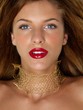closeup beauty portrait woman with golden jewels closeup beauty portrait woman with golden jewels