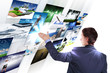 Photo: Man working with vurtial screens Man working with vurtial screens