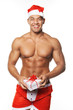 Image of sexy man wearing santa claus costume