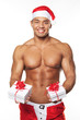 Image of sexy man wearing santa claus costume