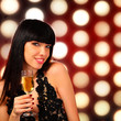 Smiling woman with a glass of champagne