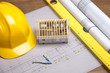 Construction plans and blueprints on wooden table