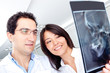 Dentists looking at an x-ray