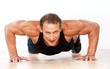 Handsome muscular man doing push-up