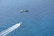 tree boats in the deep blue ocean