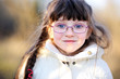 Photo: A portrait of little child girl in glasses A portrait of little child girl in glasses
