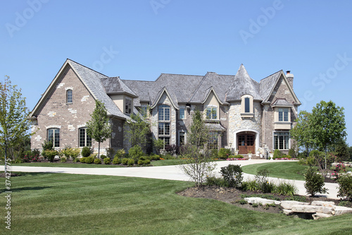 Photo: Luxury home with stone turret Luxury home with stone turret