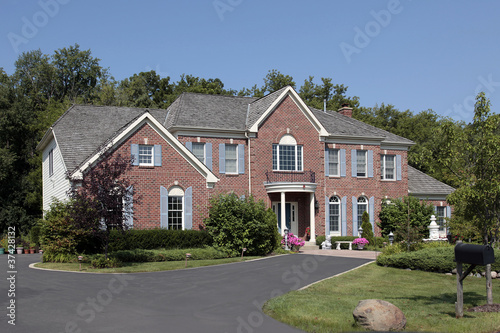 Photo: Brick home with front balcony Brick home with front balcony