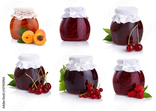 Photo: Set of jars with berry jam isolated on white Set of jars with berry jam isolated on white