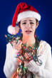 Photo: Panicked girl with Christmas lights Panicked girl with Christmas lights