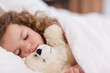 Foto: Girl sleeping with her teddy Girl sleeping with her teddy
