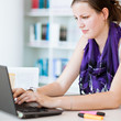 pretty female college student studying in the university library