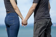 Young couple holding hands