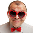 Smiling man with heart shaped sunglasses Smiling man with heart shaped sunglasses