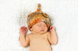 Newborn Baby Sleeping with knitted Hat on.