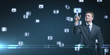 Young business man pressing a touchscreen button