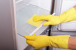 Photo: Hands cleaning refrigerator. Hands cleaning refrigerator.