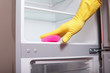 Photo: Hand cleaning refrigerator. Hand cleaning refrigerator.