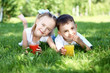 Photo: Little brother and sister in summer park Little brother and sister in summer park