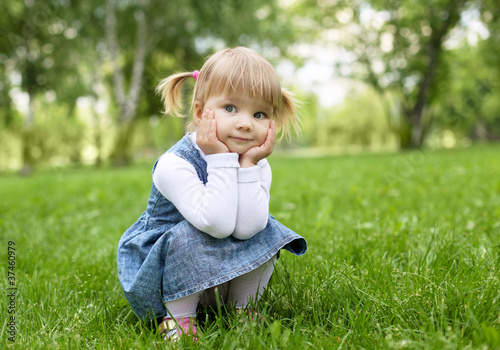 Photo: Portrait of a little girl outdoors Portrait of a little girl outdoors