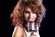 Portrait of a glamorous girl with mike singing song Portrait of a glamorous girl with mike singing song