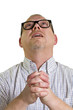 nerdy man with glasses begs forgiveness while looking up
