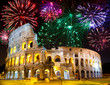 Celebratory fireworks over Collosseo. Italy. Rome.
