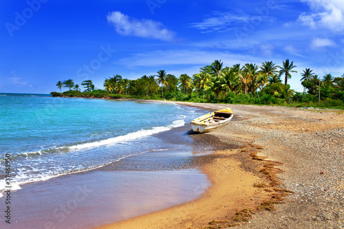 Photo: Jamaica. A national boat on sandy coast of a bay Jamaica. A national boat on sandy coast of a bay