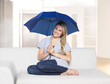 young woman with blue umbrella