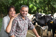 happy couple working in their farm