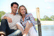 Couple relaxing on a pontoon