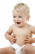 Photo: Baby girl with hands on belly isolated Baby girl with hands on belly isolated