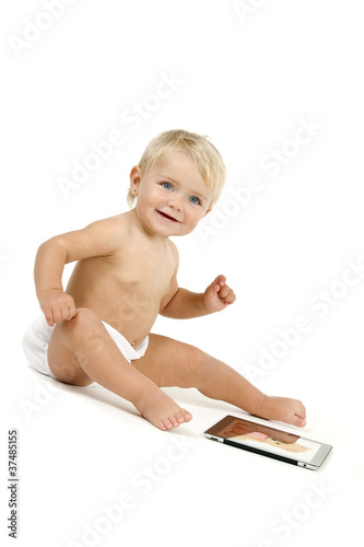 Photo: Baby girl with tablet Baby girl with tablet