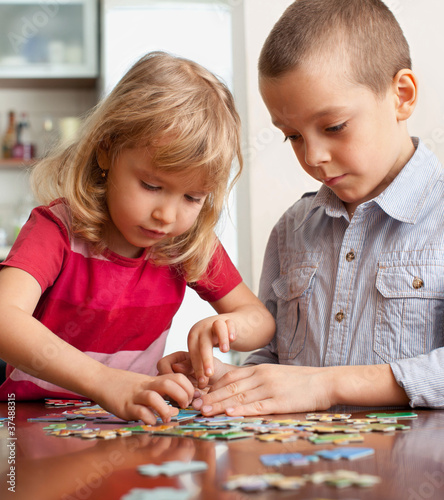 Photo: Children, playing puzzles Children, playing puzzles