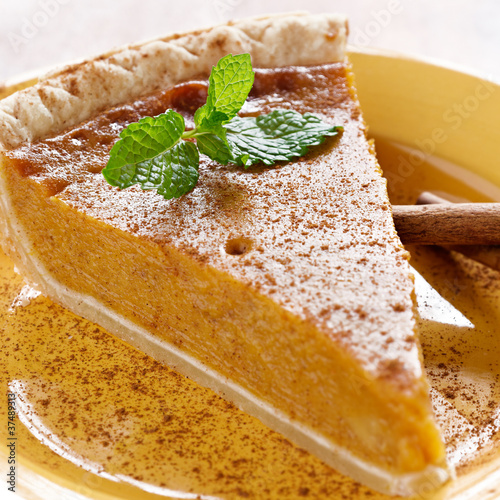 Photo: pumpkin pie with mint garnish. pumpkin pie with mint garnish.