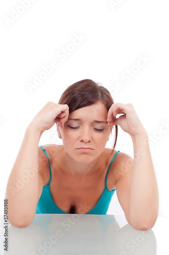 Photo: Portrait of a beautiful brunette with migraine Portrait of a beautiful brunette with migraine