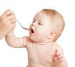 Photo: Little baby feeding with a spoon Little baby feeding with a spoon
