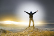 Photo: Man on peak of mountain. Man on peak of mountain.