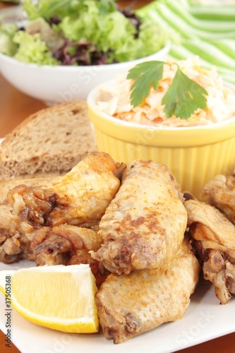 Photo: Chicken wings and coleslaw Chicken wings and coleslaw