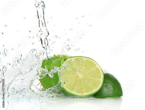 Photo: Green limes with splashing water Green limes with splashing water