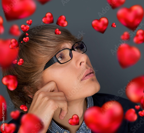Photo: Image of young man thinking of his plans about Valentine day and Image of young man thinking of his plans about Valentine day and