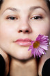 Portrait of a young girl with flower
