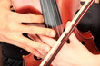 Close up of a couple holding a violin Close up of a couple holding a violin