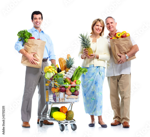 Photo: Family with a grocery shopping cart. Family with a grocery shopping cart.