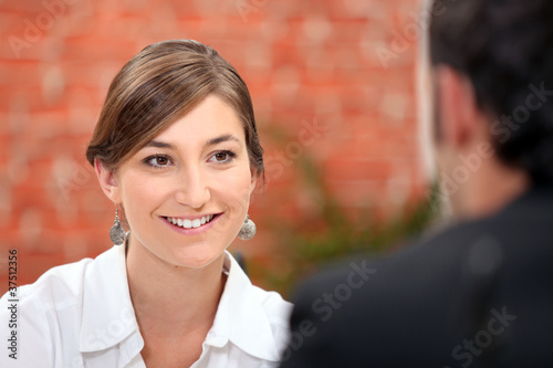 Photo: Woman smiling at her date Woman smiling at her date