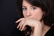 Woman covering her mouth with her hand