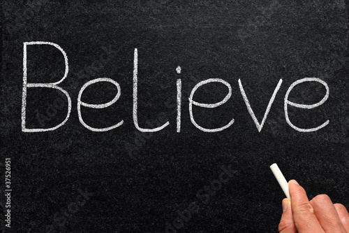 Foto: Believe, written with chalk on a blackboard. Believe, written with chalk on a blackboard.