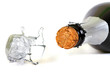 Bottle of champagne with cork over white background